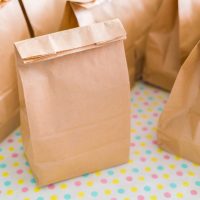 Brown paper bags on table